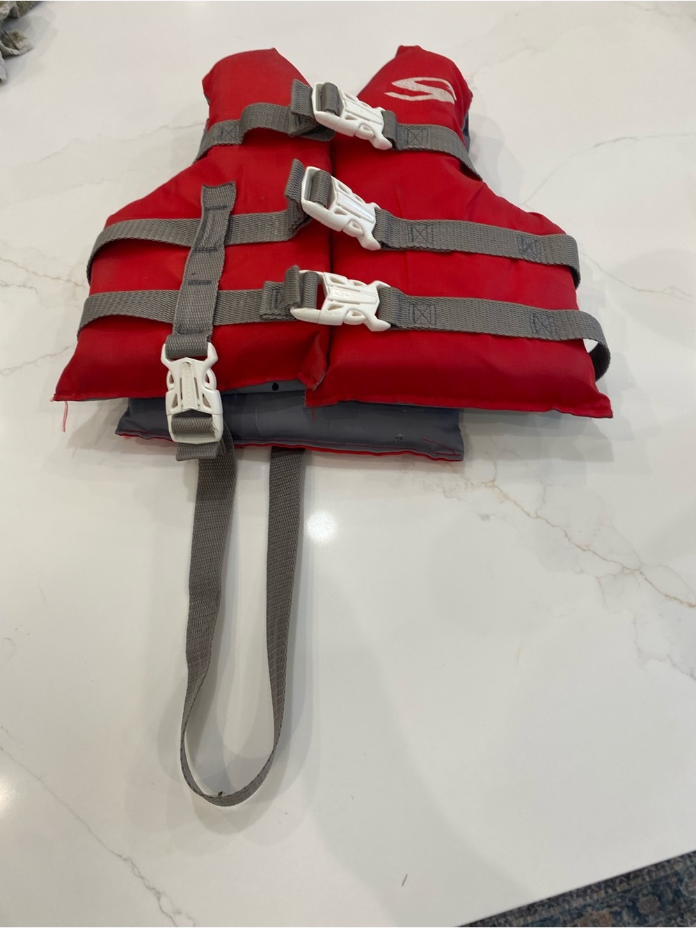 Child's Red Swim Vest with Gray Straps and White Buckles